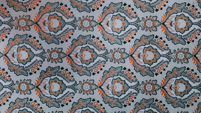 a close up po of an orange, gray and black pattern