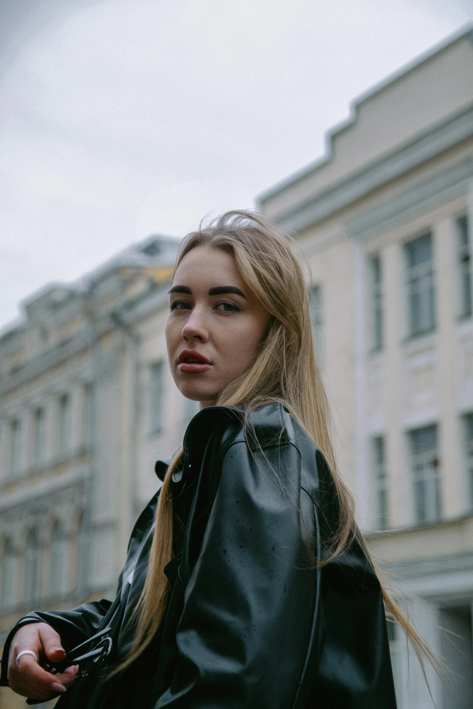 a woman wearing black leather jacket, with a leather jacket on