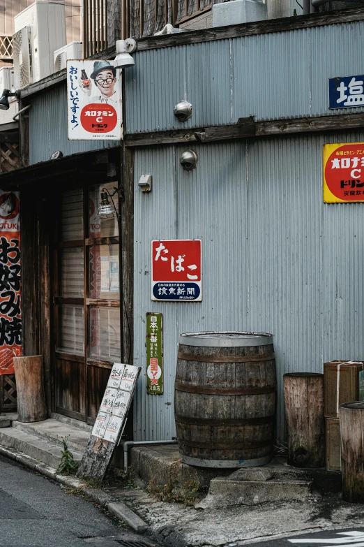 a store with a wooden barrel is shown on a street corner