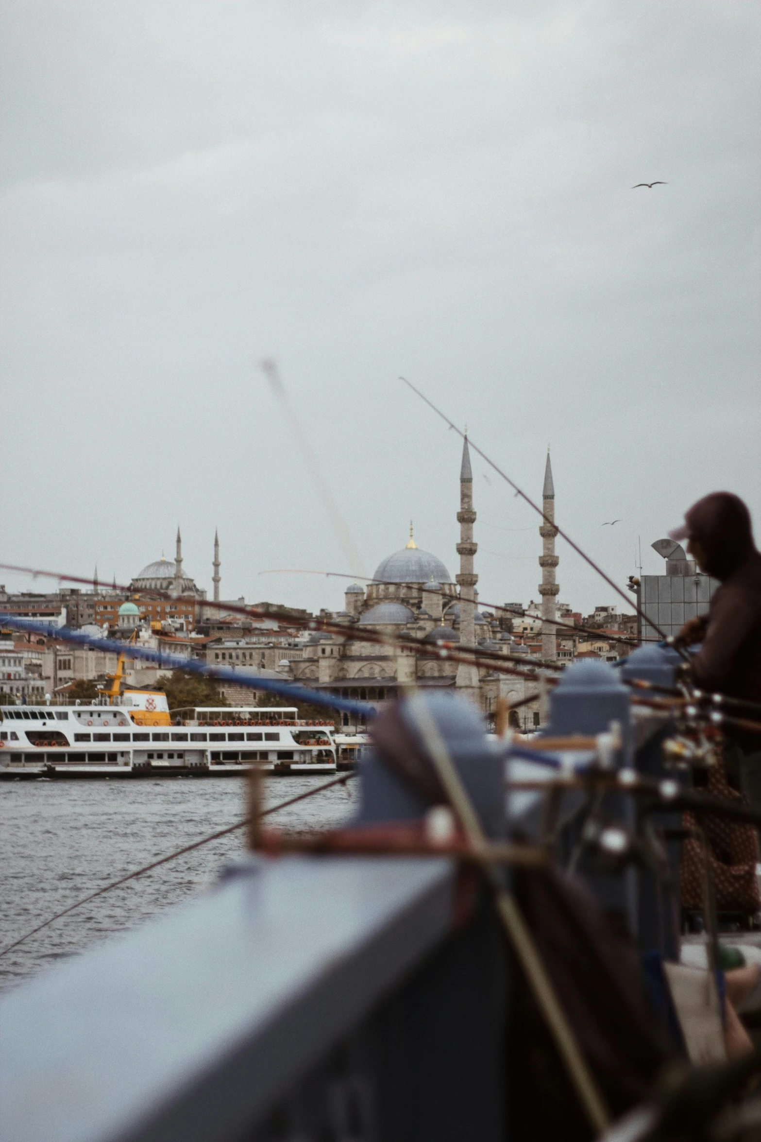 an image of a boat on the water with people fishing