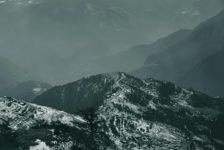 a view of mountains from an airplane in the sky