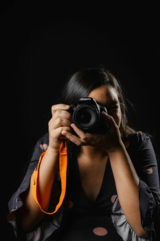 a woman taking a picture with her camera