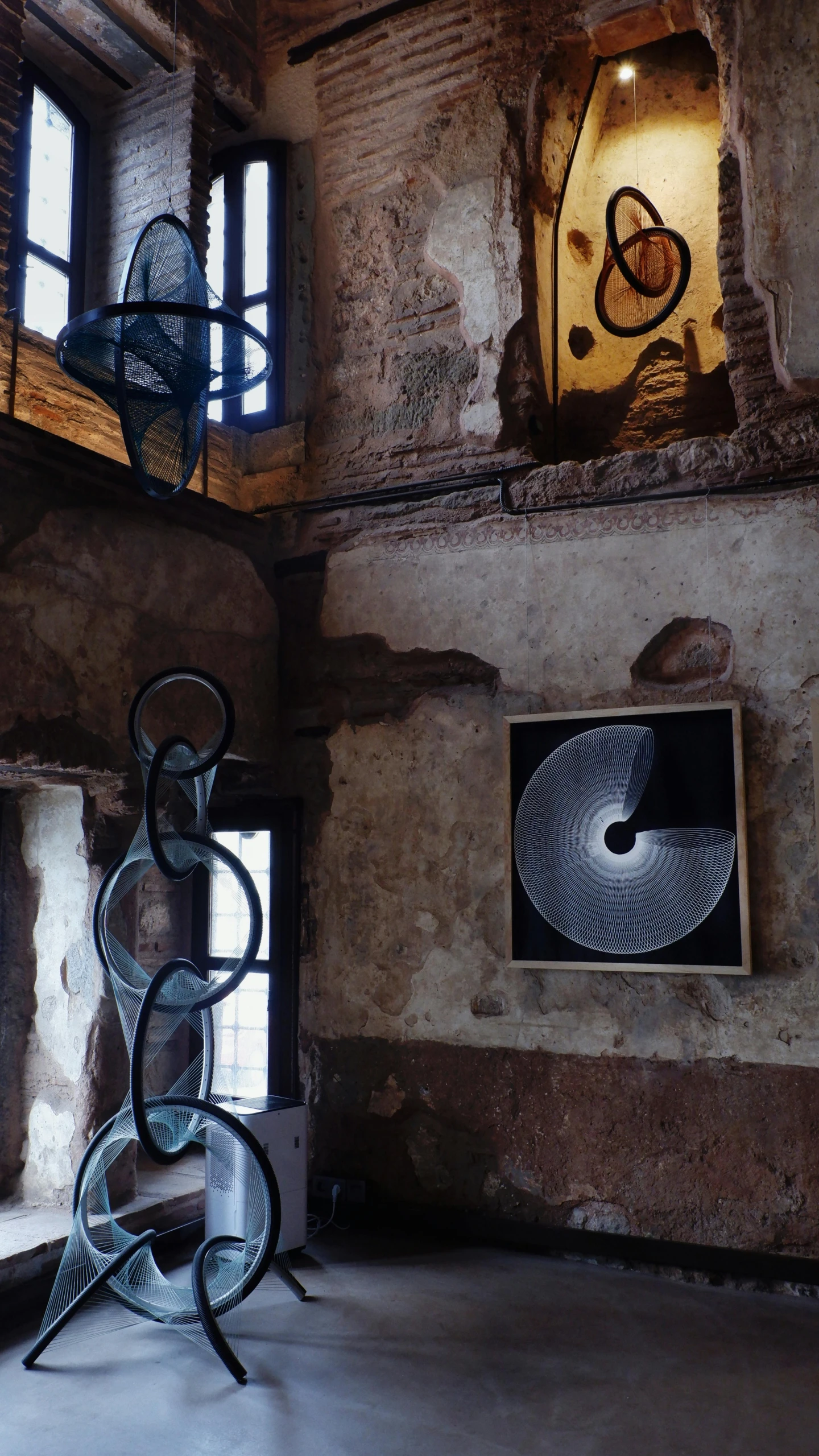 sculptures in a stone walled room in the middle of town