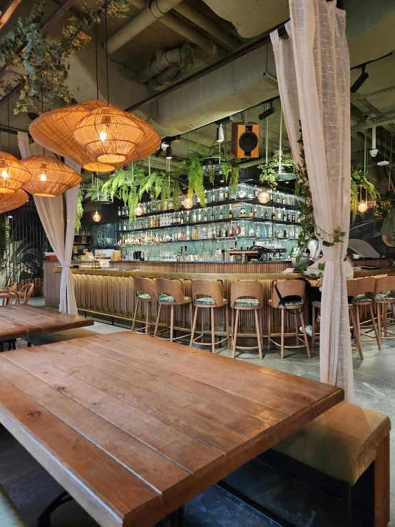 an indoor area with many tables and chairs