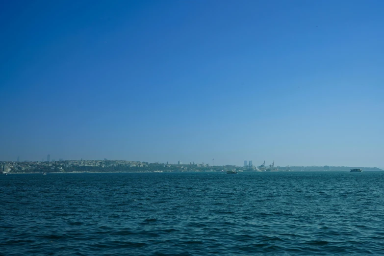 the ocean with two sail boats in it