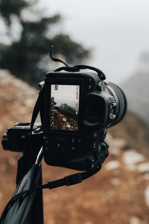 the camera has been set up in front of a mountain landscape