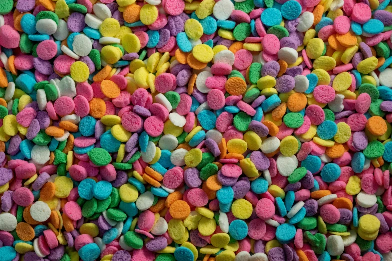 multi colored candies on a white surface