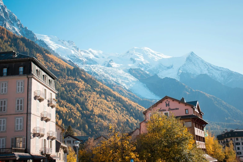 a mountain range with a snowy peak in the distance