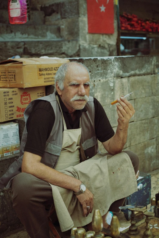 a man smokes a cigarette on the street