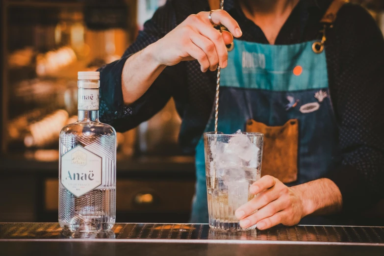 the bartender is mixing drinks behind a bar counter