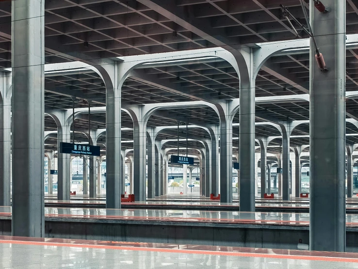 a group of poles in an open air parking garage