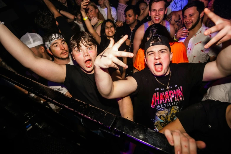 people in the crowd enjoying some music at a concert