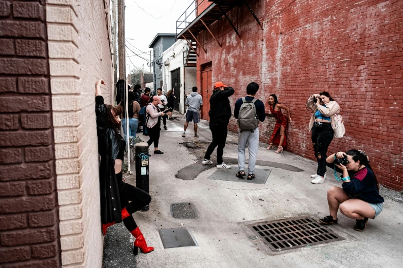 a group of people that are outside near some buildings