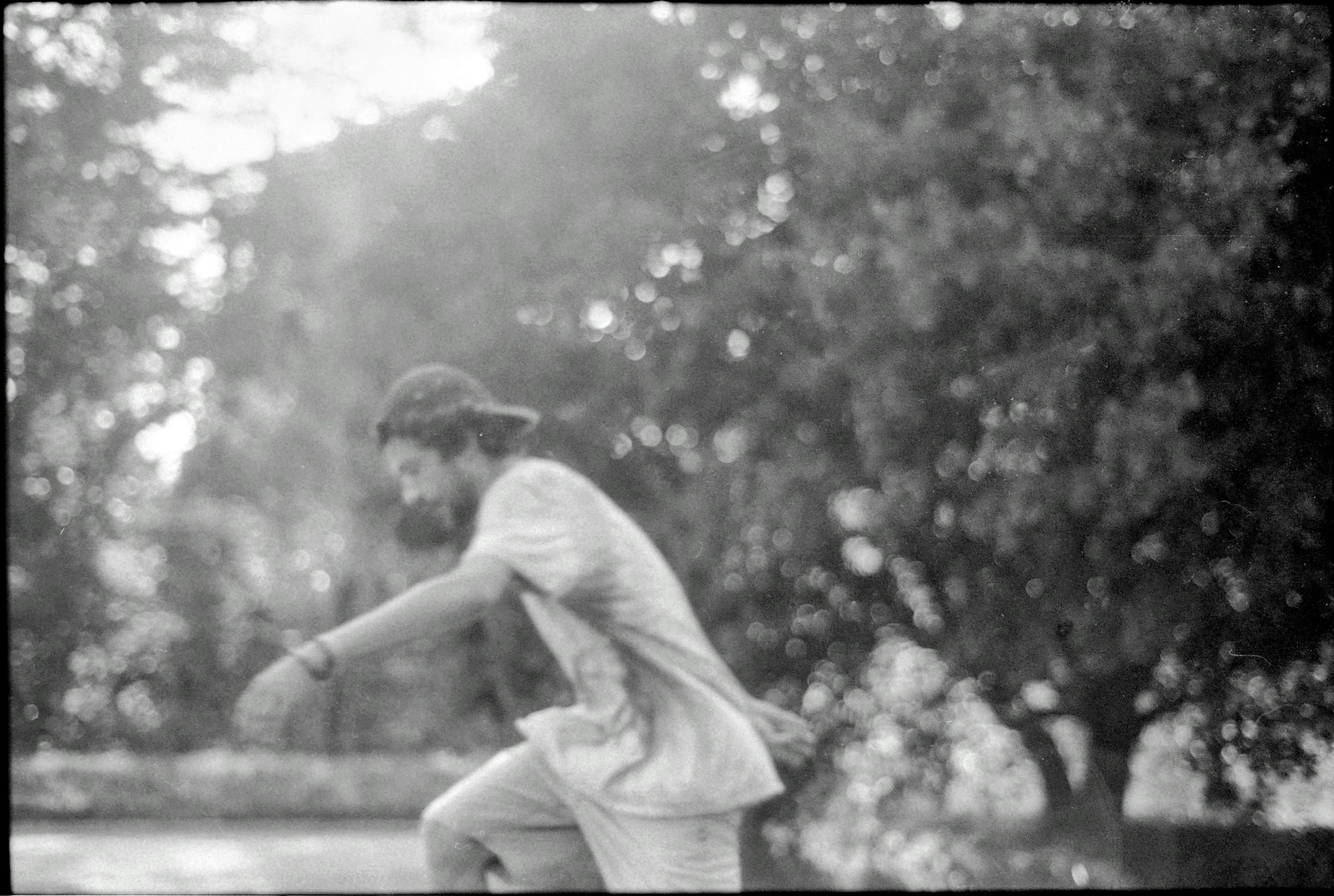 a man in a white shirt is playing ball