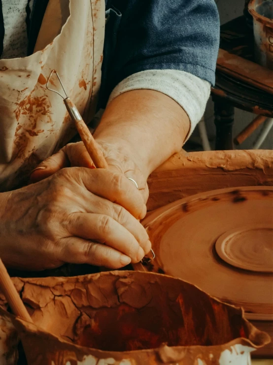 a woman is putting a knife in a bowl