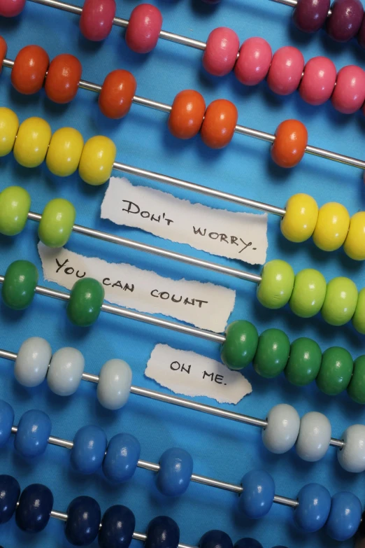 a colorful display of candy beads and candy sticks