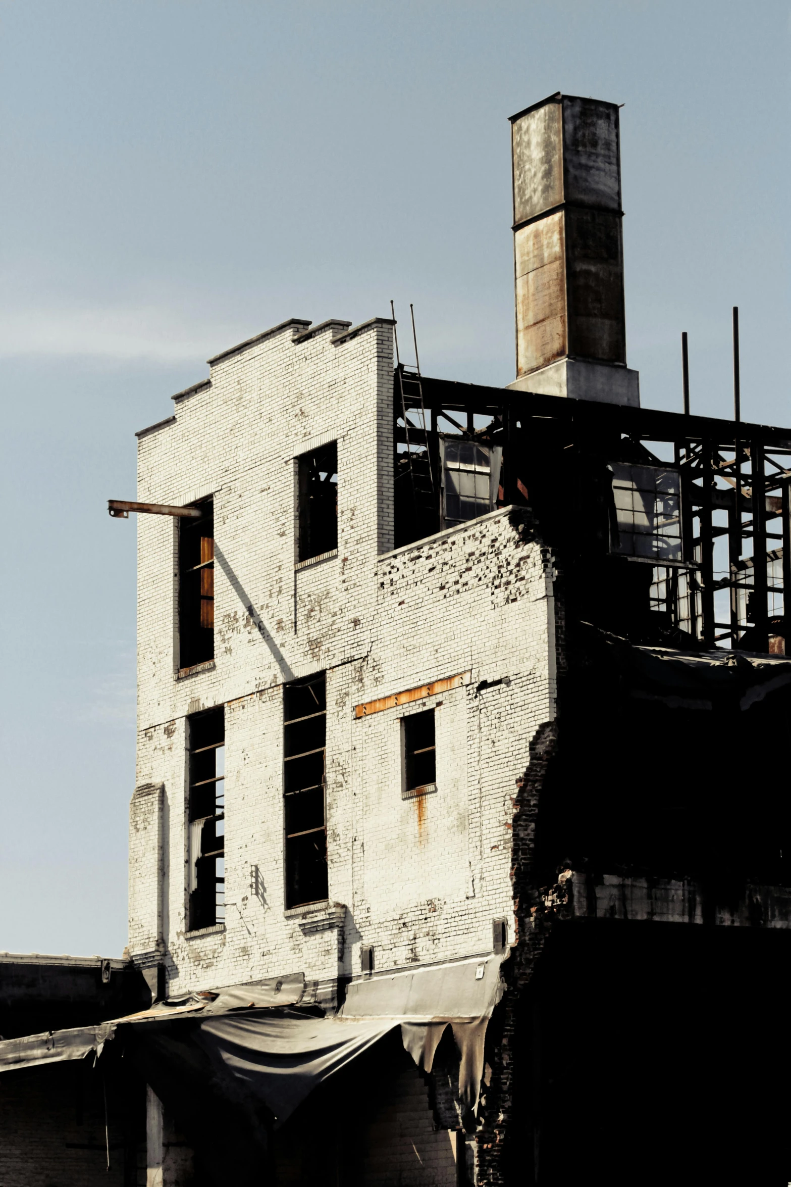 there is a very old building with many broken windows