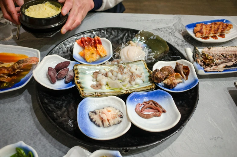 the platter is full of assorted seafood on it