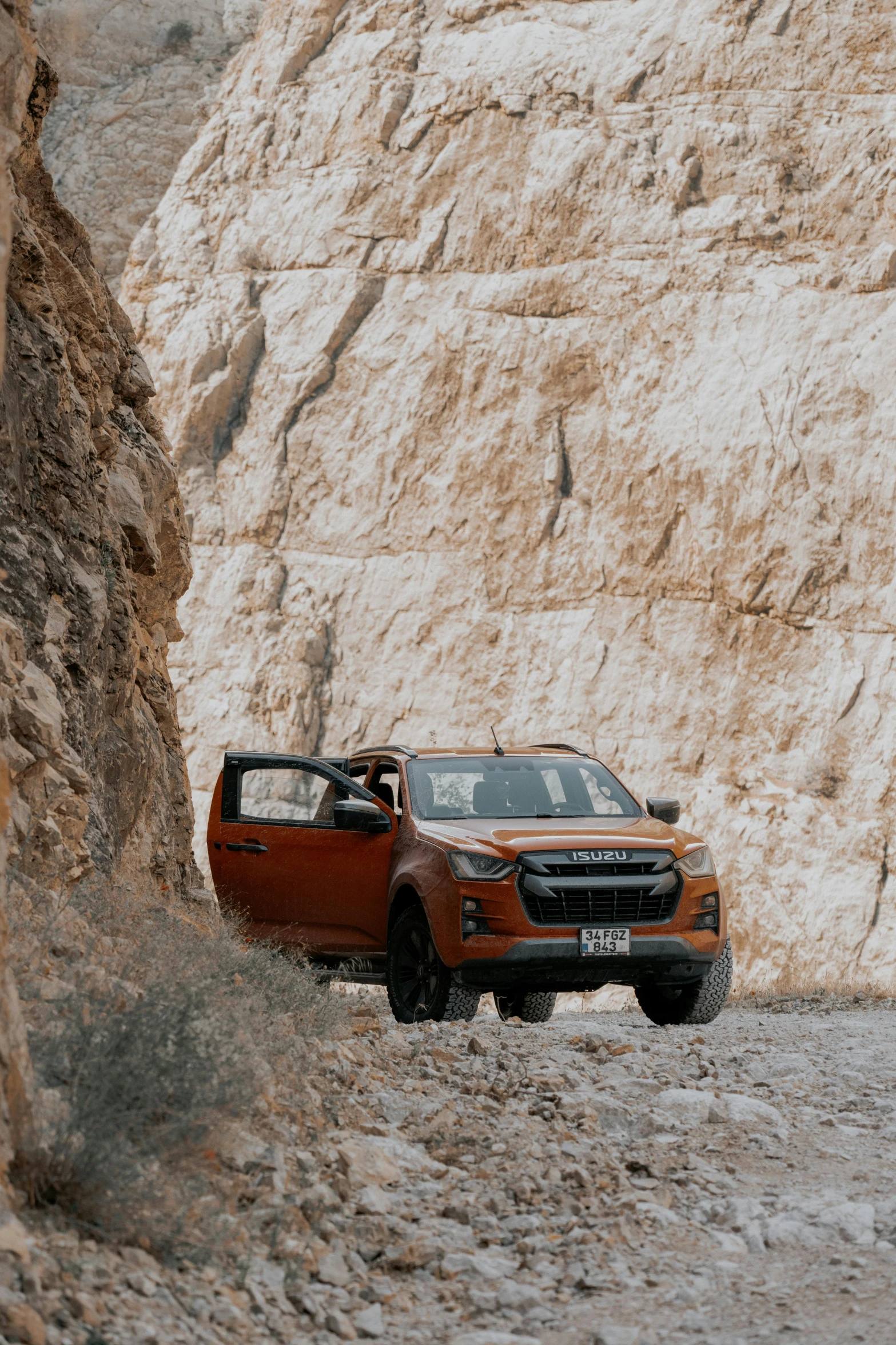 two trucks that are sitting on the side of a mountain