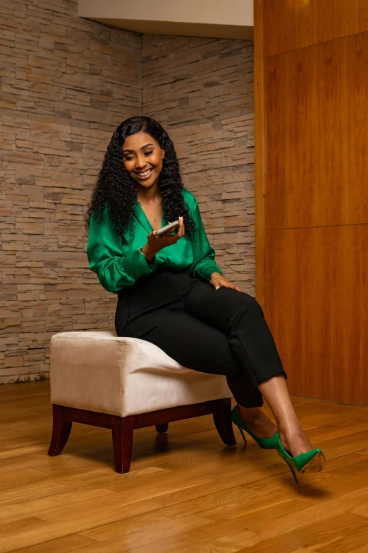 a woman sitting on a chair and smiling