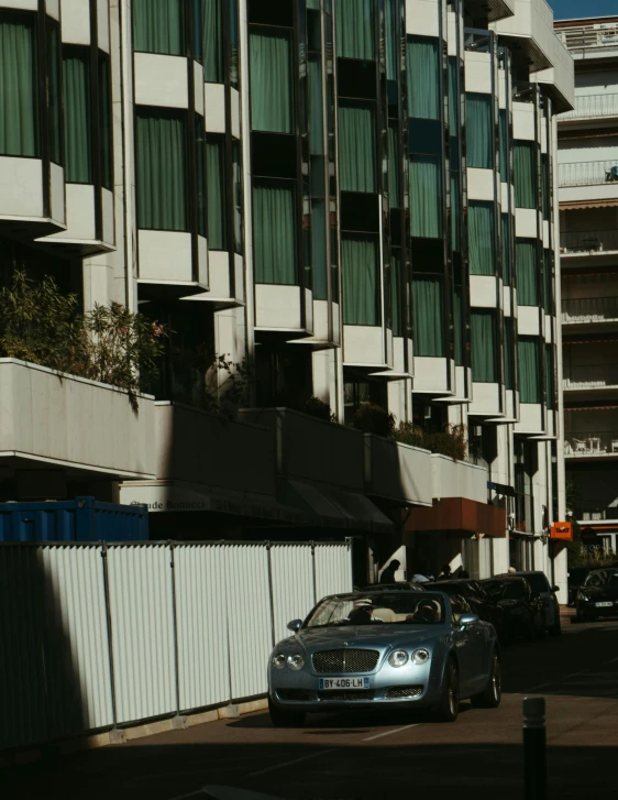 two cars parked in front of an office building