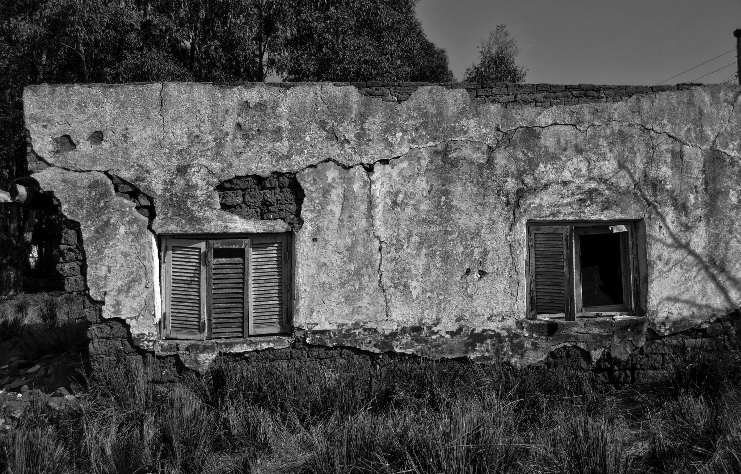 black and white pograph of an old house made out of concrete