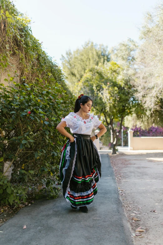 woman in traditional mexican dress and big black bag