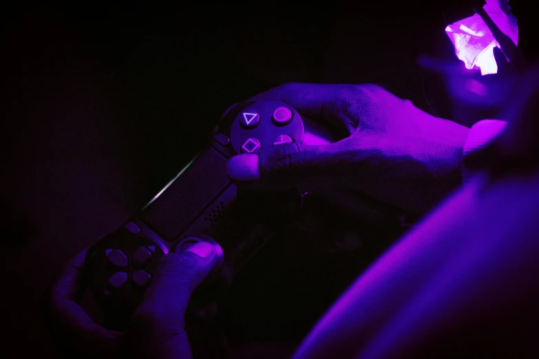 a person holding a controller in their hand