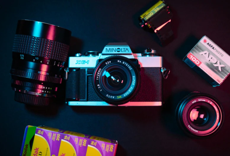 a camera that is on a table next to a flash drive