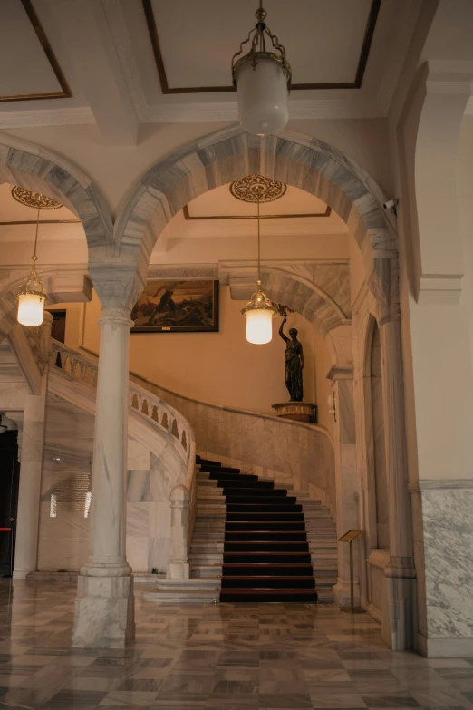 there is an ornate marble building with a large staircase