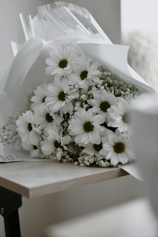 flowers lying on the counter in a white room