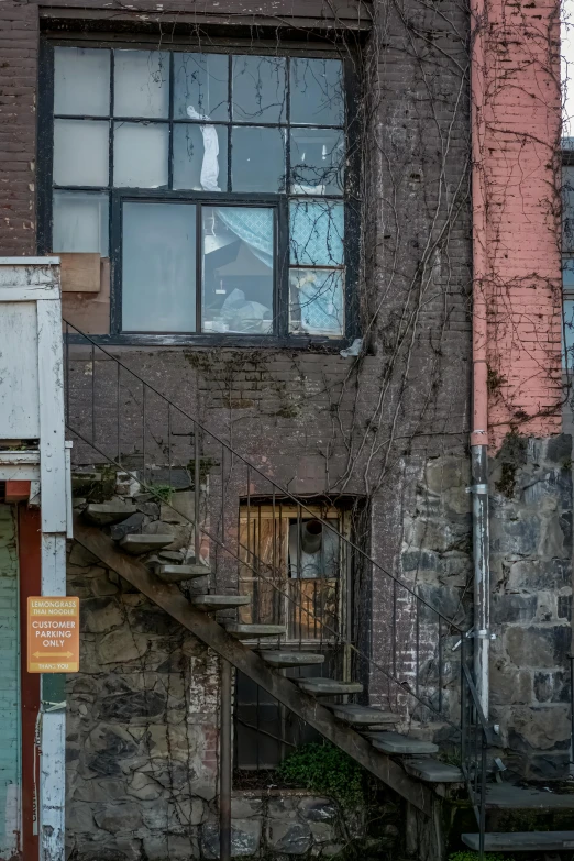 an old building with a staircase in front of it