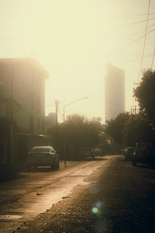 car on a quiet city street near buildings