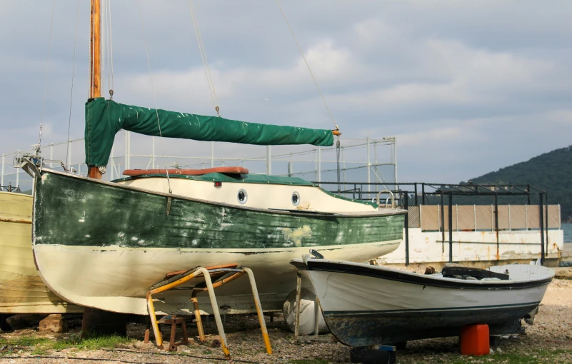 two large boats parked next to each other on land