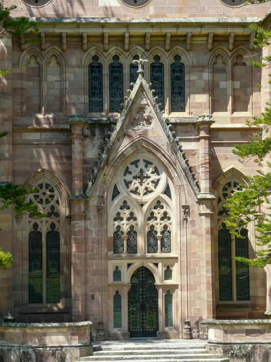 an old building with stairs leading up to a very large doorway