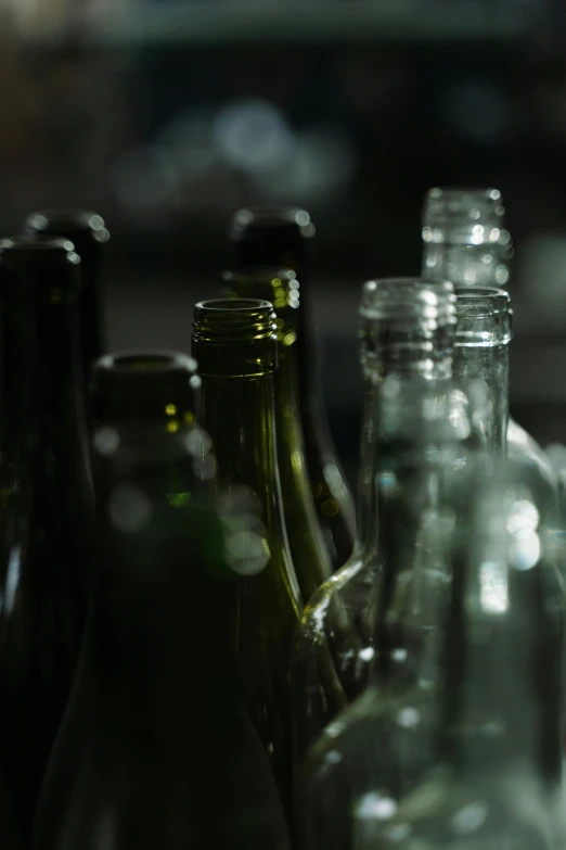 a lot of empty glass bottles are sitting on a table