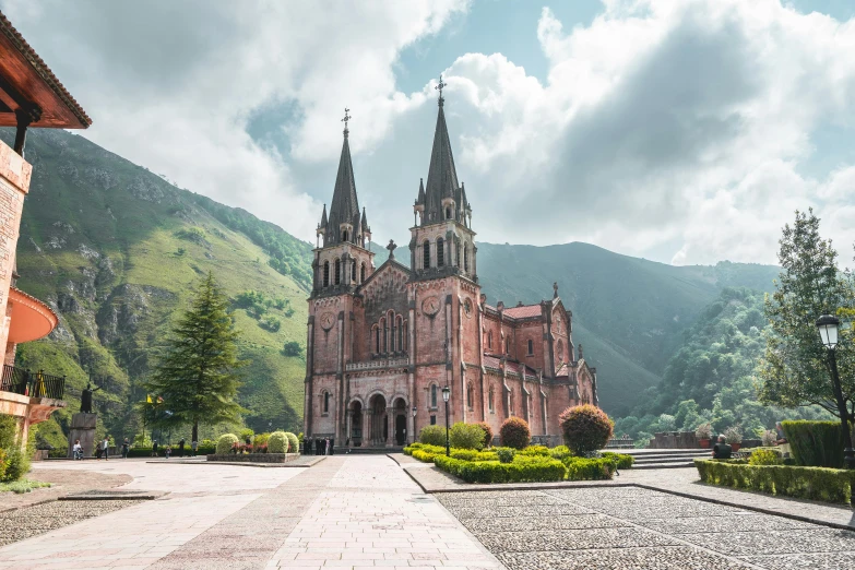 a very large church near some mountains