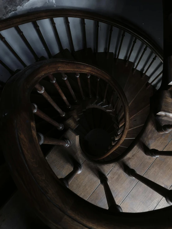 view down into a spiral wood staircase