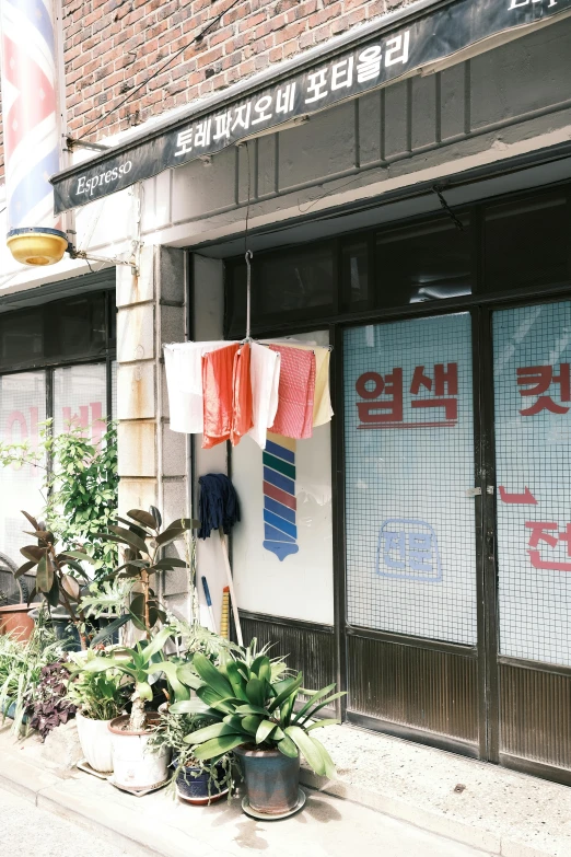 a couple of people standing outside of a store