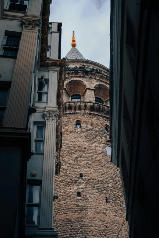 the view of a very tall building, through buildings