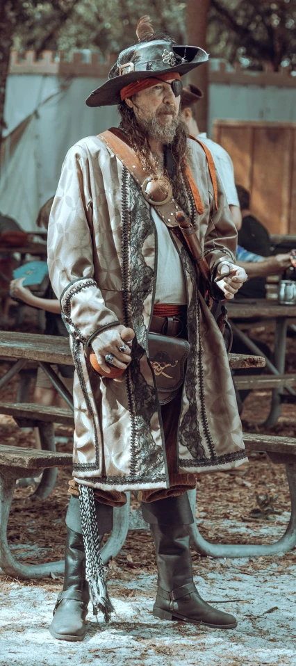 an old man wearing a western outfit