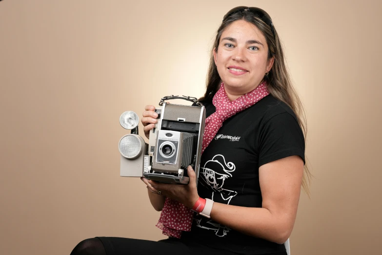 this is an image of a lady taking a picture with an old - fashioned camera