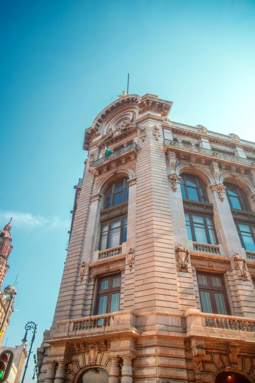 an ornate, brick building has a clock on the side of it