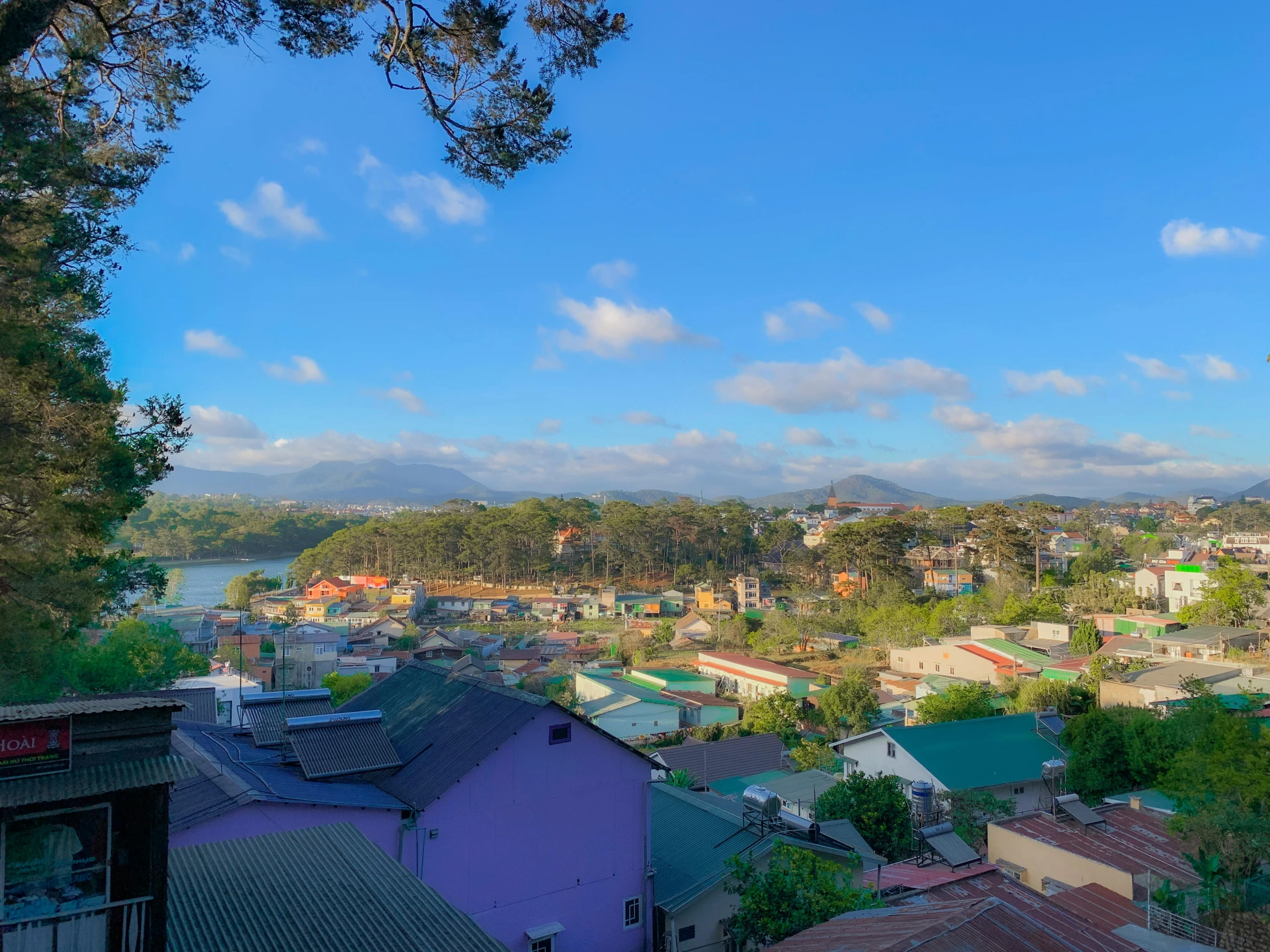 a blue sky with a city below it