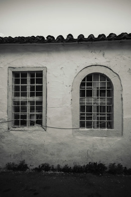 a black and white po of three windows