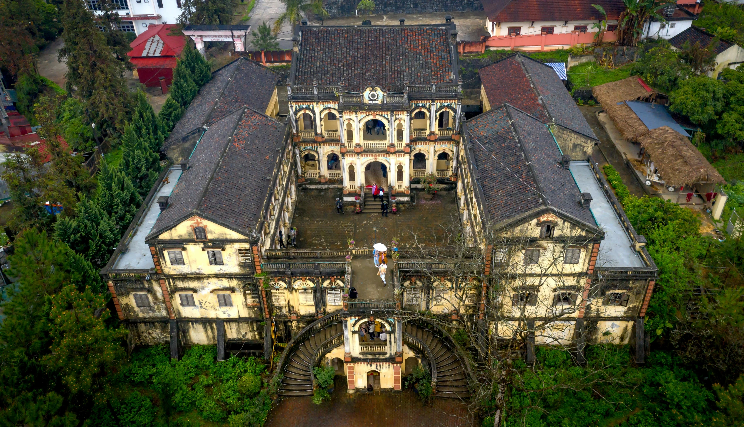 an aerial view of a building in a village