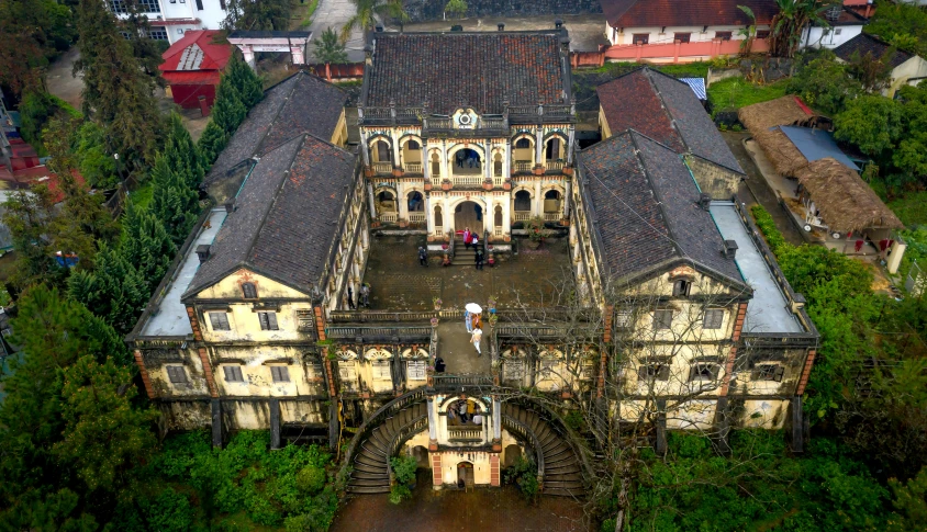 an aerial view of a building in a village