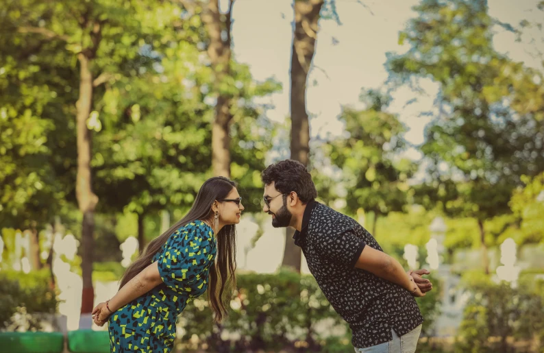 an image of a man and woman going for a kiss