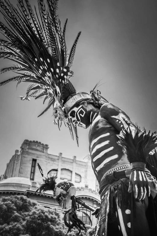 two mexican dancer in elaborate dress and headdress