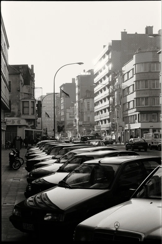 cars parked in a line in the city